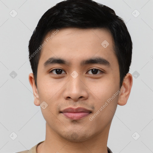 Joyful asian young-adult male with short  black hair and brown eyes