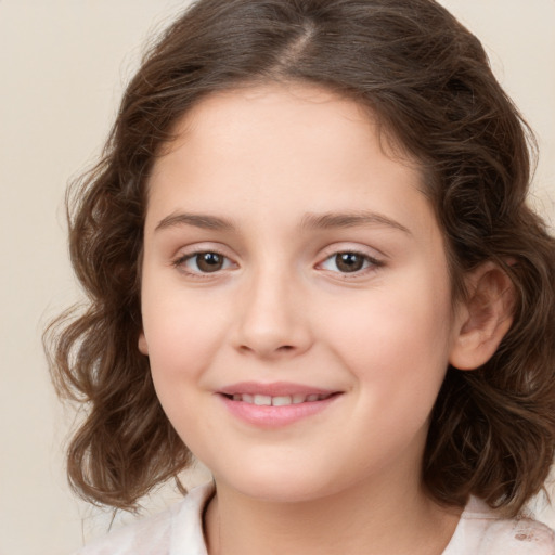 Joyful white child female with medium  brown hair and brown eyes