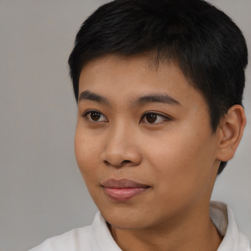 Joyful asian young-adult male with short  black hair and brown eyes