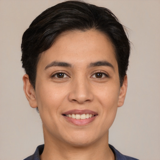 Joyful white young-adult female with short  black hair and brown eyes
