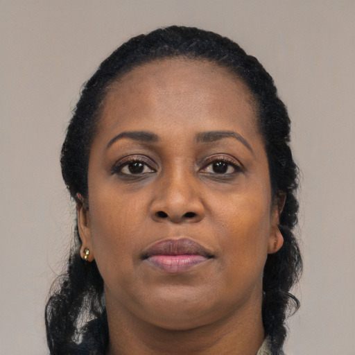 Neutral black adult female with long  brown hair and brown eyes