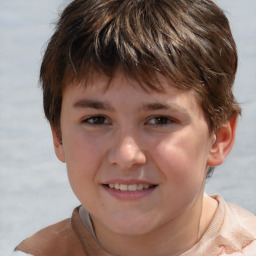 Joyful white child male with short  brown hair and brown eyes