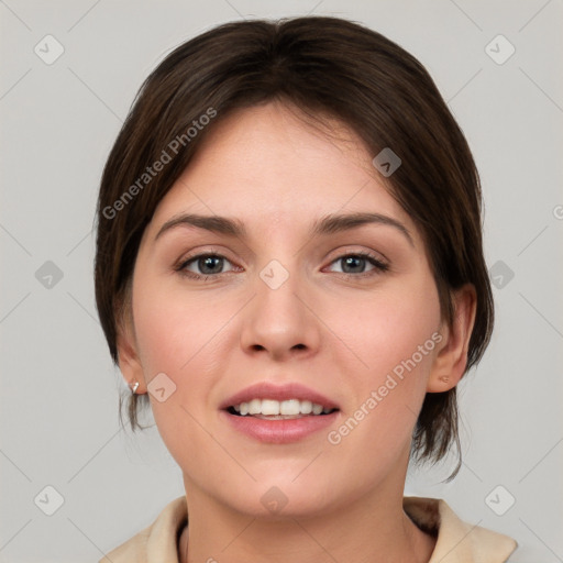 Joyful white young-adult female with medium  brown hair and green eyes