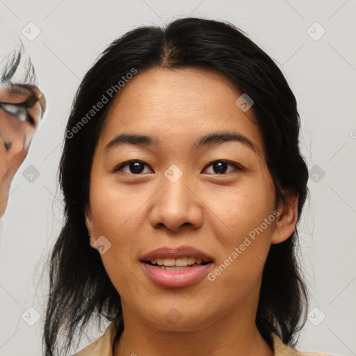 Joyful asian young-adult female with medium  brown hair and brown eyes