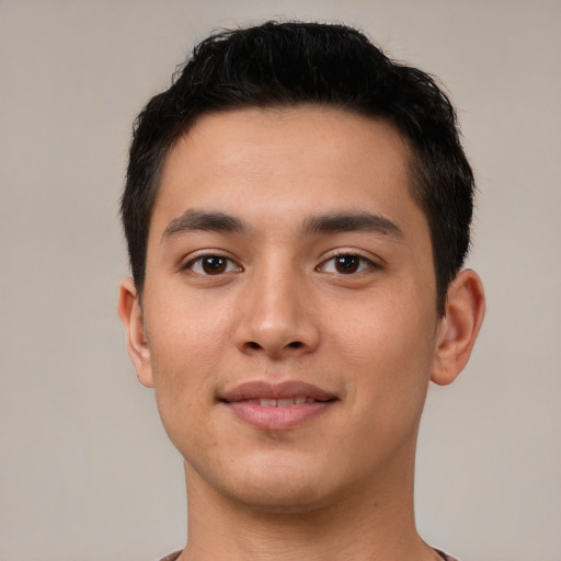 Joyful latino young-adult male with short  brown hair and brown eyes