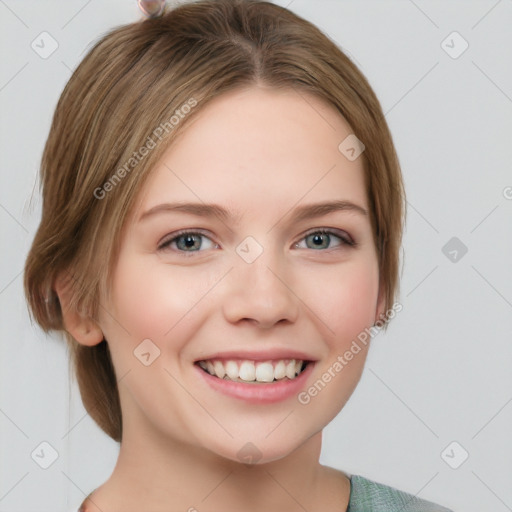 Joyful white young-adult female with medium  brown hair and grey eyes