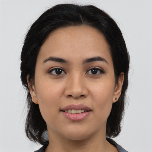 Joyful white young-adult female with medium  black hair and brown eyes