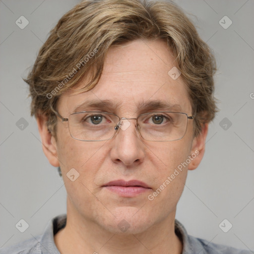 Joyful white adult male with short  brown hair and grey eyes