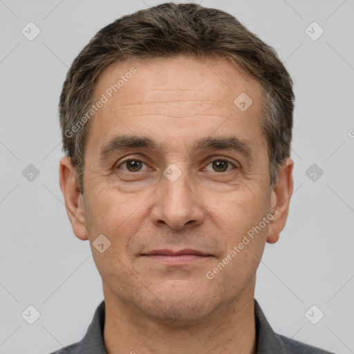 Joyful white adult male with short  brown hair and brown eyes