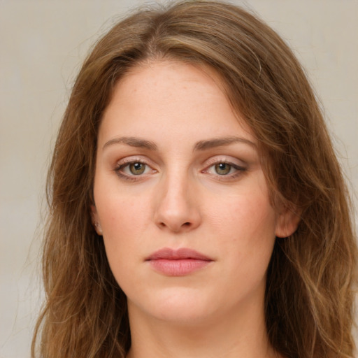 Neutral white young-adult female with long  brown hair and green eyes