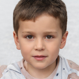 Joyful white child male with short  brown hair and brown eyes