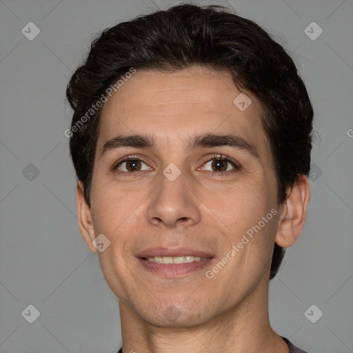 Joyful white adult male with short  brown hair and brown eyes