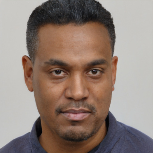 Neutral black young-adult male with short  black hair and brown eyes