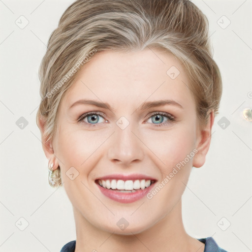 Joyful white young-adult female with medium  brown hair and blue eyes