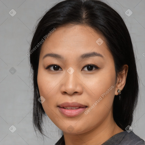 Joyful asian young-adult female with medium  black hair and brown eyes