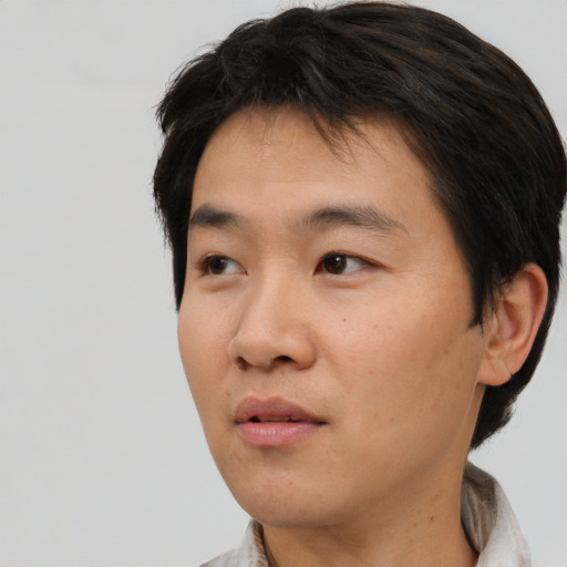 Neutral asian young-adult male with short  brown hair and brown eyes
