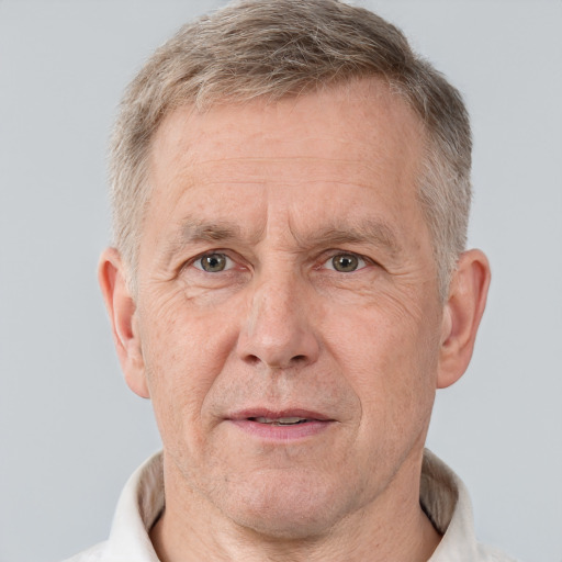 Neutral white middle-aged male with short  gray hair and brown eyes