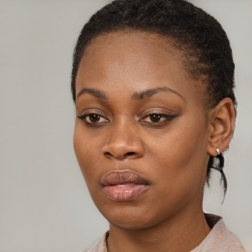 Neutral black young-adult female with short  brown hair and brown eyes