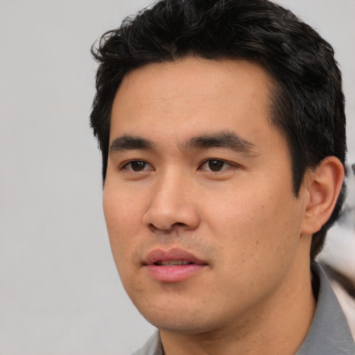 Neutral asian young-adult male with short  black hair and brown eyes