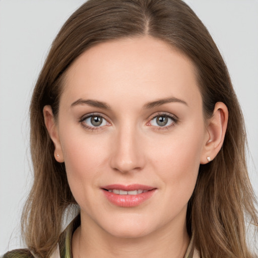 Joyful white young-adult female with long  brown hair and grey eyes