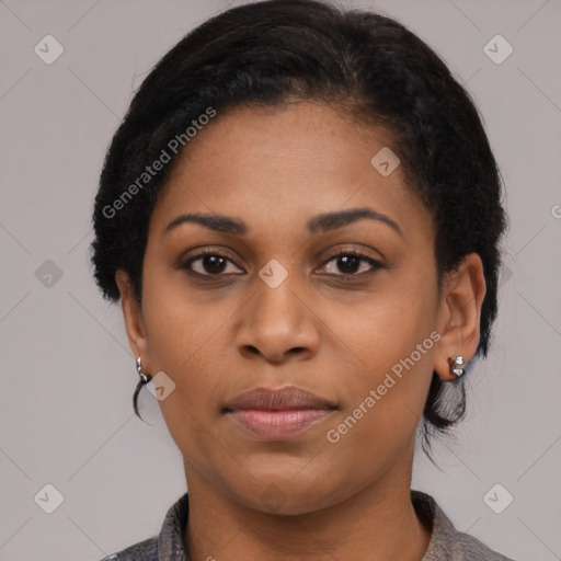 Joyful black young-adult female with medium  black hair and brown eyes