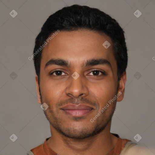 Joyful black young-adult male with short  black hair and brown eyes