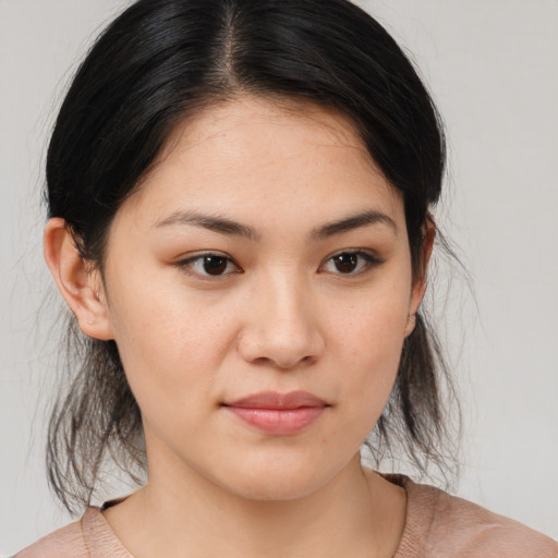 Joyful asian young-adult female with medium  brown hair and brown eyes