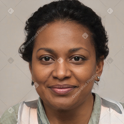 Joyful black adult female with medium  brown hair and brown eyes