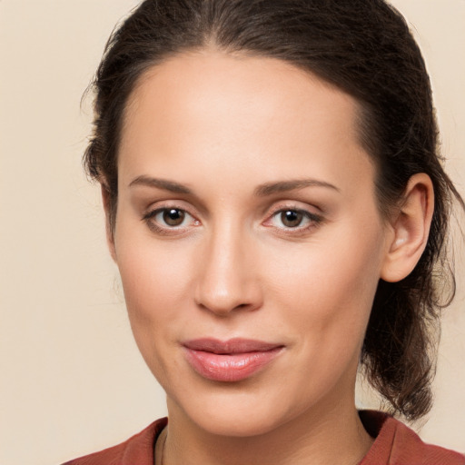 Joyful white young-adult female with long  brown hair and brown eyes