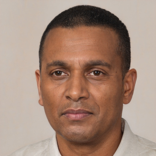 Neutral black adult male with short  black hair and brown eyes