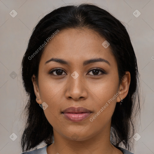 Joyful latino young-adult female with medium  brown hair and brown eyes