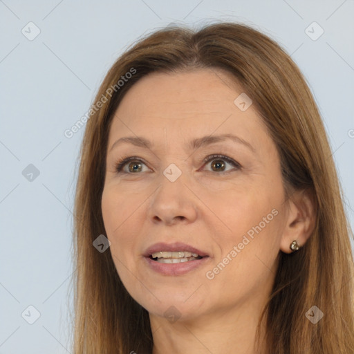 Joyful white adult female with long  brown hair and brown eyes