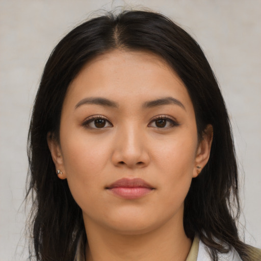 Neutral latino young-adult female with long  brown hair and brown eyes