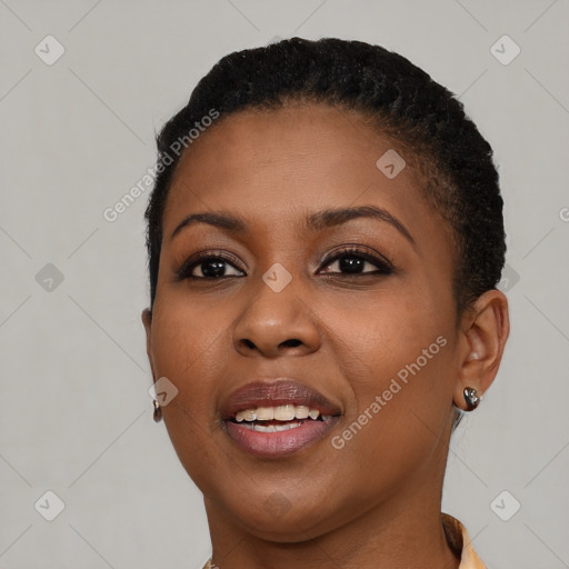 Joyful black young-adult female with short  brown hair and brown eyes