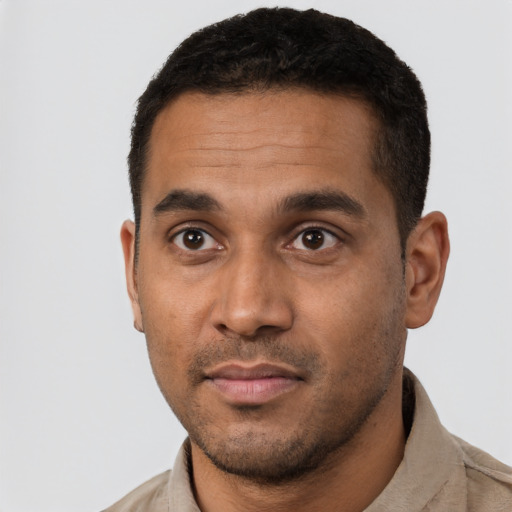 Neutral black young-adult male with short  black hair and brown eyes
