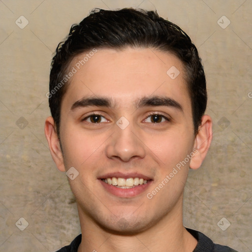 Joyful white young-adult male with short  black hair and brown eyes