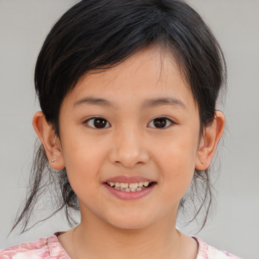 Joyful asian child female with medium  brown hair and brown eyes