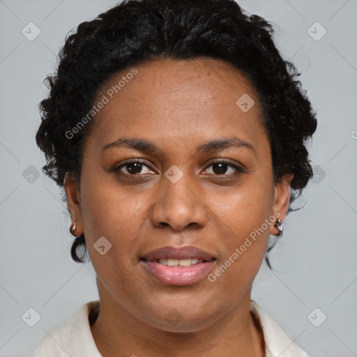 Joyful black adult female with short  brown hair and brown eyes