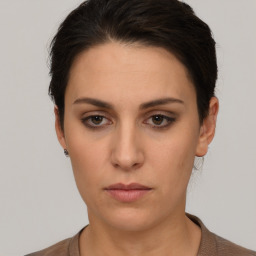 Neutral white young-adult female with short  brown hair and brown eyes