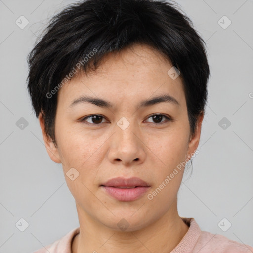 Joyful asian young-adult female with short  black hair and brown eyes