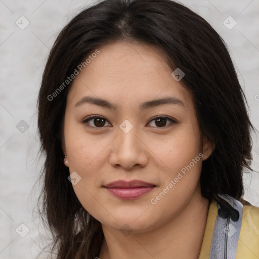 Joyful asian young-adult female with long  brown hair and brown eyes