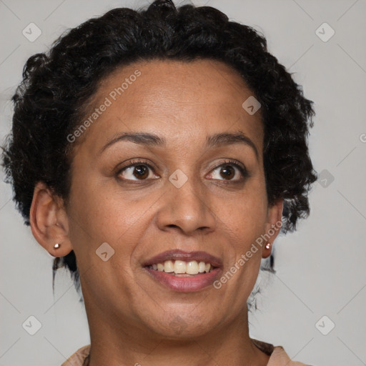 Joyful black adult female with short  brown hair and brown eyes