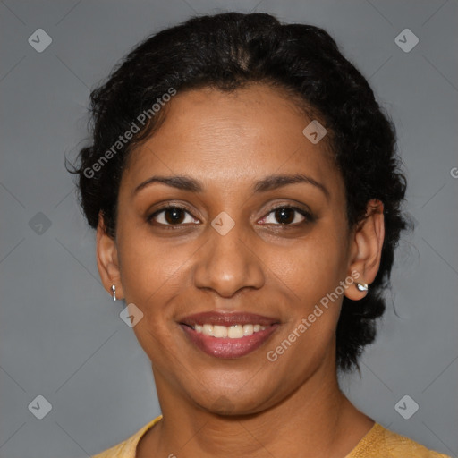 Joyful black young-adult female with short  brown hair and brown eyes