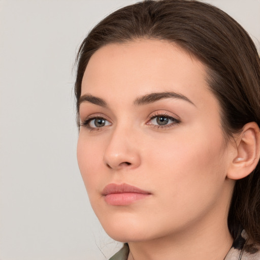 Neutral white young-adult female with medium  brown hair and brown eyes