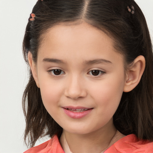 Joyful white child female with long  brown hair and brown eyes