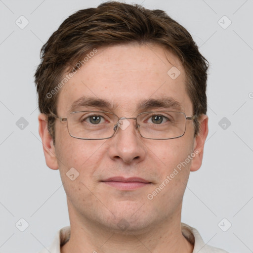 Joyful white adult male with short  brown hair and grey eyes