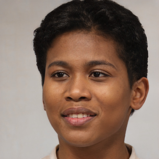 Joyful black young-adult female with short  black hair and brown eyes
