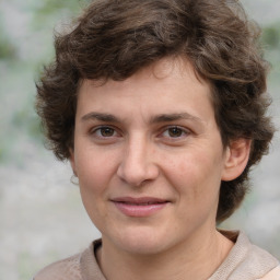 Joyful white young-adult male with medium  brown hair and brown eyes