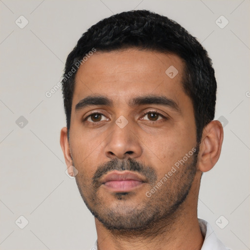 Neutral latino young-adult male with short  black hair and brown eyes
