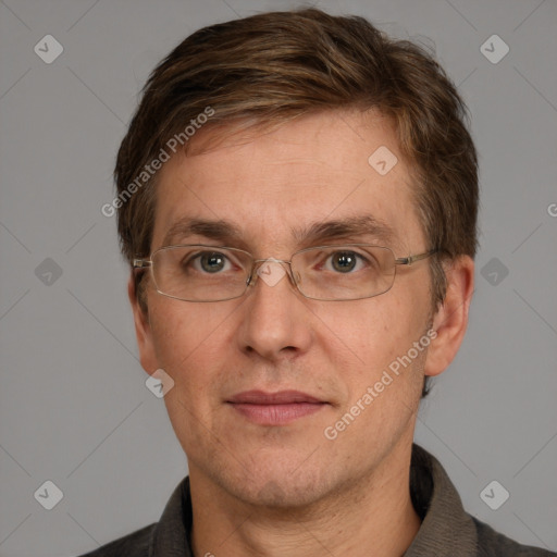 Joyful white adult male with short  brown hair and grey eyes